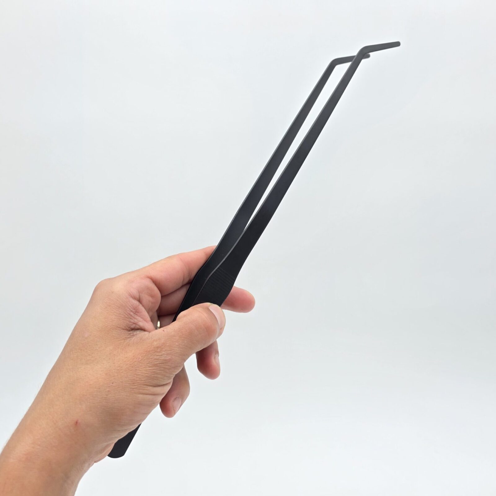 Pince nourrissage 37 cm noir courbé